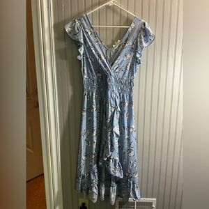 New With Tags. Floral Blue Ruffle Dress. Size medium.